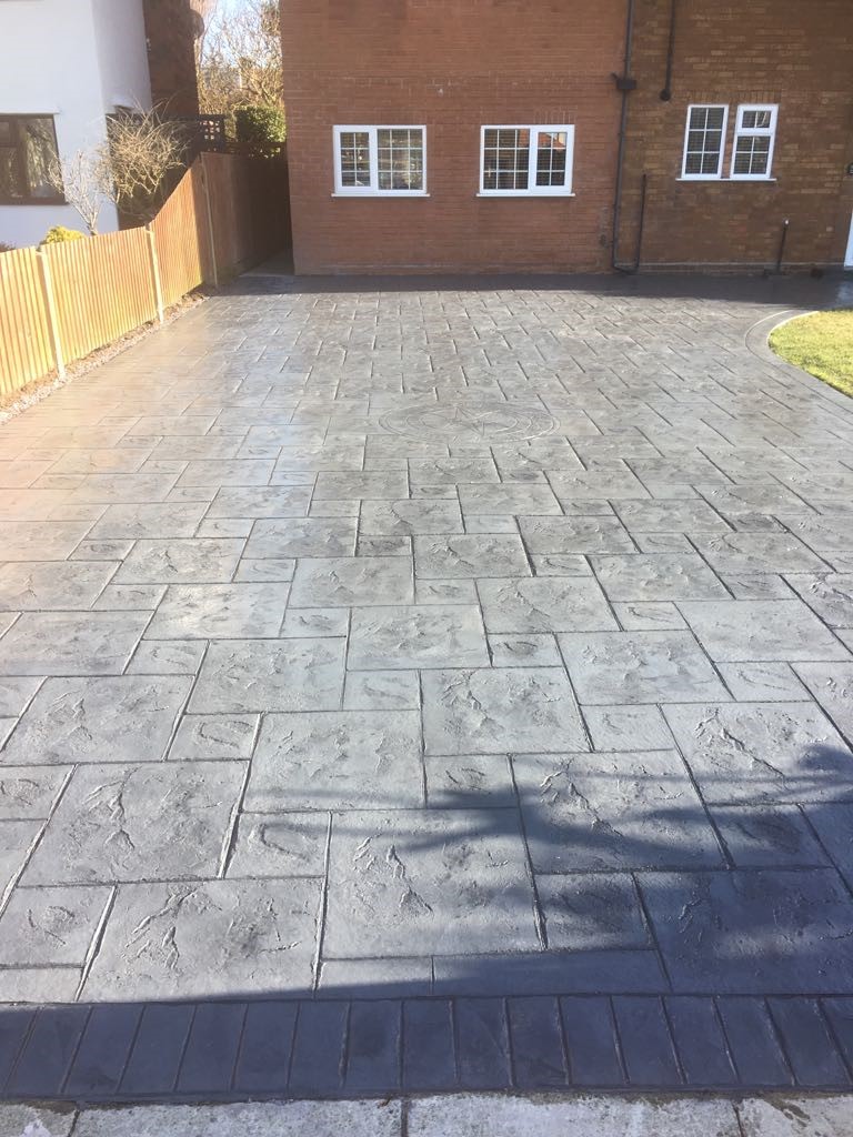 Pattern imprinted concrete driveway- with compass imprint.