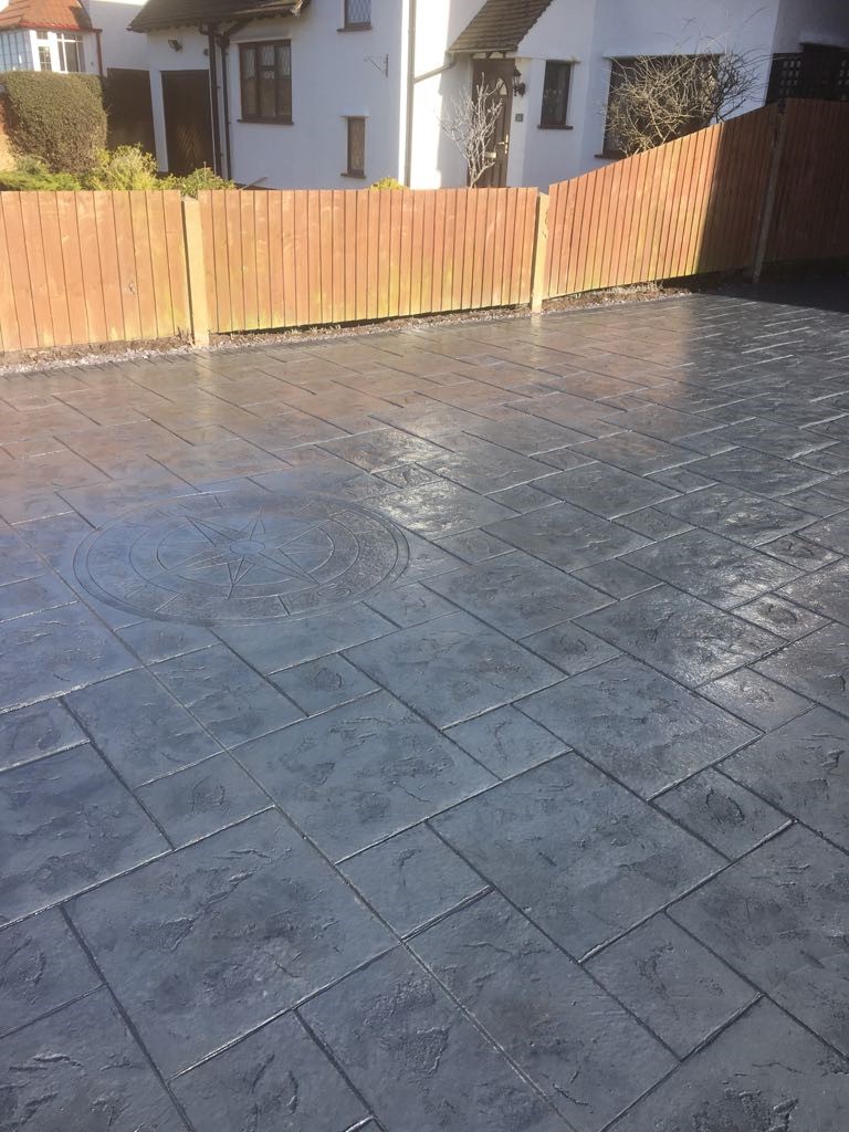 Pattern imprinted concrete driveway- with compass imprint