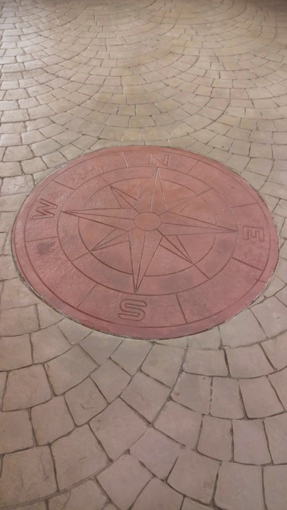 Driveway with printed compass,.