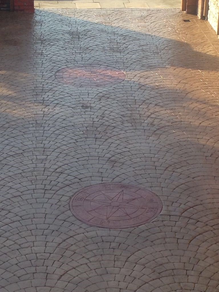 Driveway with printed compass'